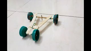 How To Make A Rubber Band Car Easily [upl. by Aihsekal]