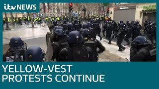 Water cannons and tear gas used to clear ChampsElysees in Paris  ITV News [upl. by Ynnatirb1]