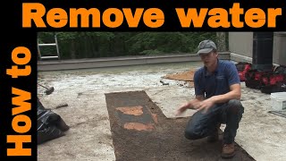 How to remove water from a flat roof [upl. by Bartel30]