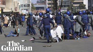 Zimbabwe riot police use teargas and batons to clear protesters [upl. by Nesyla]