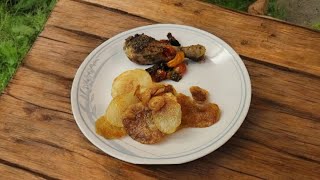 Roasted chicken legs with tomatoes and mushrooms served with homemade potato chips and salt [upl. by Elspet159]