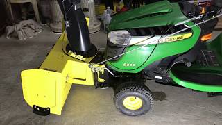 Reinstalling a snowblower on a John Deere S240 lawn tractor [upl. by Letsirk]