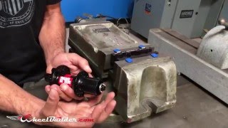 How to remove axle end caps using the Park Tool AV5 Axle Vise Tool [upl. by Melissa276]