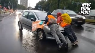 Irate drivers ram into climate protesters blocking traffic drag them hundreds of feet down highway [upl. by Wertheimer]