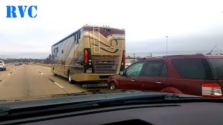 Fleetwood Discovery 40E Motorhome pulling a car driving down the highway [upl. by Ahsaten]