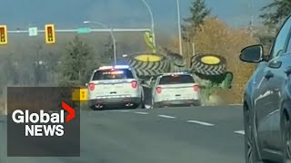 Tractor flips during police chase on BC highway [upl. by Nnoj52]