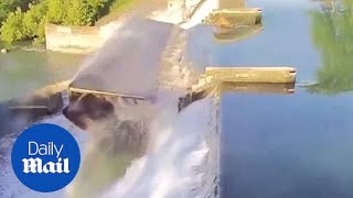 Water rushes past a floodgate after it breaks at Lake Dunlap [upl. by Airoled]