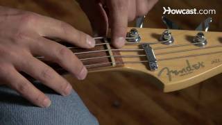 How to Restring a Bass Guitar  Guitar Lessons [upl. by Sesom]