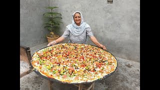 PIZZA  GIANT PIZZA ON BIG TAWA  VEG PIZZA RECIPE PREPARED BY MY GRANDMA  VEG VILLAGE FOOD [upl. by Atinnor933]