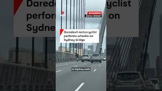 Daredevil motorcyclist performs wheelie on Sydneys Anzac Bridge [upl. by Leahicm]