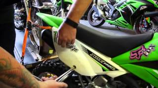 2012 Kawasaki KLX110L How To Install A Battery [upl. by Wehhtam]