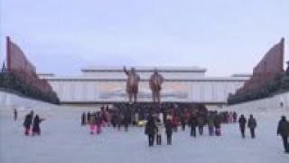 North Koreans lay flowers at leaders statues [upl. by Eadith690]