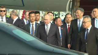 Russias Putin arrives in China  AFP [upl. by Standley]