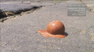 Timelapse Chocolate ball melts on ground in three minutes in Australias 42C heat [upl. by Harragan594]