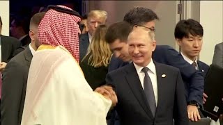 Putin and Saudi crown prince share hearty handshake at G20 [upl. by Auqinat]