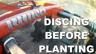 Using a Disc Harrow Discing a field [upl. by Leeke]