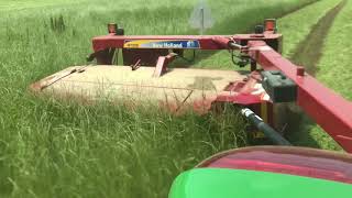 Part 2 JD 5065M and NH H7220 DiscBine mowing hay [upl. by Amethist261]