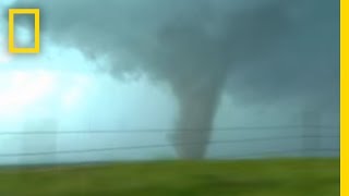 Tornadoes Lightning in Rare Video  National Geographic [upl. by Eanod]