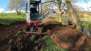 Cutting Paths Into A Hill Side With A Mini Digger Takeuchi TB216 Excavator [upl. by Mecke]