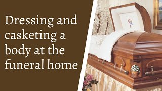 Dressing and casketing a body at the funeral home [upl. by Raviv]