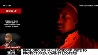 Two rival groups in Klerksdorp set aside their differences to protect their area against looting [upl. by Enilemme]