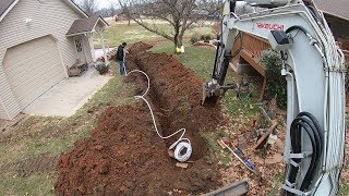 Digging A Water Line With The Takeuchi TB153fr [upl. by Allerbag]