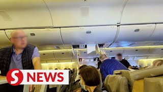 SIA flight turbulence British pensioner dies 16 Malaysian passengers on board [upl. by Appolonia]