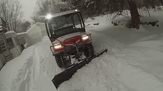 Kubota RTV900 Plowing Snow [upl. by Yadnil]