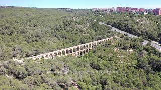 Aerial Stock Footage Flying with Drone over Nature with old Aqueduct bridge in Tarragona [upl. by Ellivro]