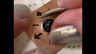 Setting a Cabochon Stone in a Bezel Cup Using a Burnishing Tool [upl. by Arbmik]