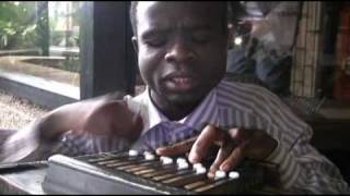 Bassy In Malawi  Blind man playing an instrument [upl. by Ailadgim512]