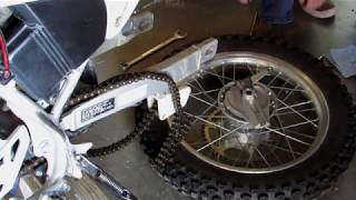 Motorcycle rear wheel removal Honda CRF 230F [upl. by Thorlay]