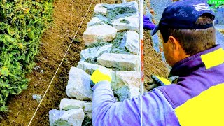 NATURAL STONE RETAINING WALL DETAIL TIPS ADVICE HOW TO BUILDING TUTORIAL ROCK MASONRY CONSTRUCTION [upl. by Lodmilla135]