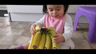 Baby eating banana with skin [upl. by Jarib]