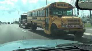 THOMAS SCHOOL BUS FROM SCHOOL AUCTION BEING TOWED WITH A BIG TOW TRUCK [upl. by Elatan]