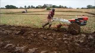 Power tiller operation by plough and ratavator at irrigation farm [upl. by Oralla985]