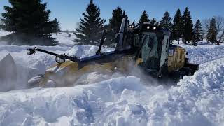 Cat 140M2 working deep snow with Falls V plow [upl. by Maggee]