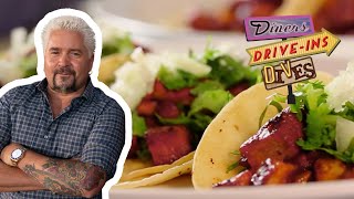 Guy Fieri Eats Some OUTSTANDING Tacos Al Pastor  Diners DriveIns and Dives  Food Network [upl. by Ahsoyem855]