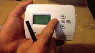 How to program a Honeywell Pro 4000 thermostat [upl. by Calandra]