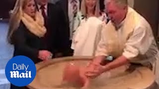 Baptism goes wrong as baby FACEPLANTS into the water [upl. by Nosyt649]