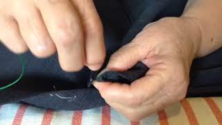 Sewing a button back on a suit jacket [upl. by Margarethe]