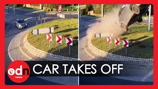 Shocking Moment Car ‘Flies Over Roundabout in Poland [upl. by Arimat]