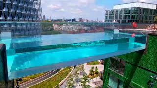 SKY POOL LONDON EMBASSY GARDENS THE WORLDS FIRST FLOATING POOL TRANSPARENT POOL 115 FEET HIGH [upl. by Yatnohs718]