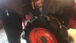 Installing GripStuds on tractor tire [upl. by Eneleh]