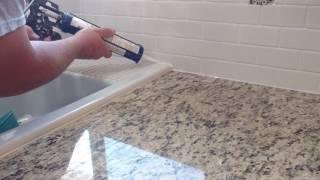 How to install silicone caulk around kitchen countertop shower bath tub etc [upl. by Notac96]