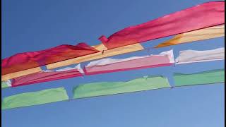 The prayer flags blue sky and the Potala Palace of Tibet [upl. by Cormier]