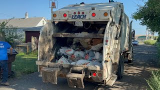 Small Leach Rear Loader Garbage Truck Packing Trash [upl. by Sosthina579]