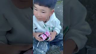 Dad takes his child out for a walk while playing with his phone His son kicks the boy next door [upl. by Enutrof]