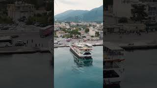 Vertical video Igoumenitsa Greece Lefkimmi Lines ferry unloads in the port at the pier Aerial [upl. by Tada]