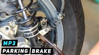 Piaggio MP3  Parking Brake Cable Installation by Wheel  Mitchs Scooter Stuff [upl. by Siloum124]